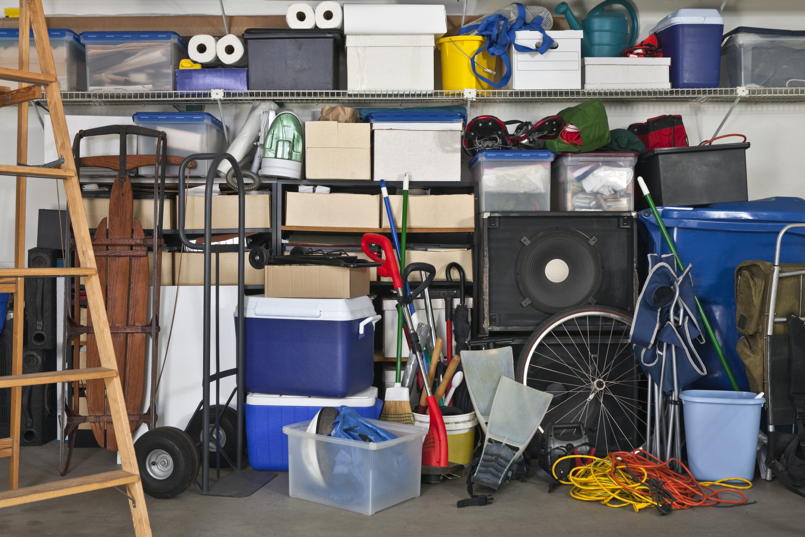 Overloaded suburban garage. Boxes, coolers, sporting gear and more.