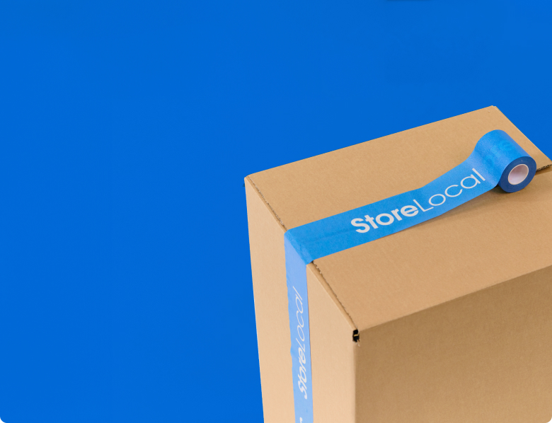 A cardboard box with blue tape on a blue background.